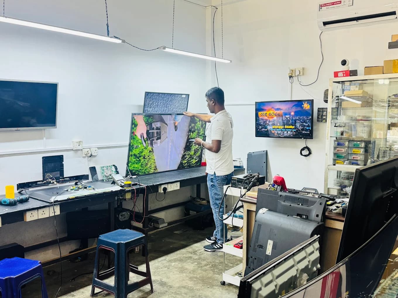 Technician testing TV display